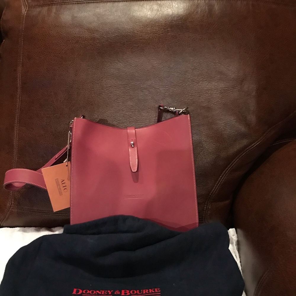 Dooney & Bourke pale pink hobo style bag